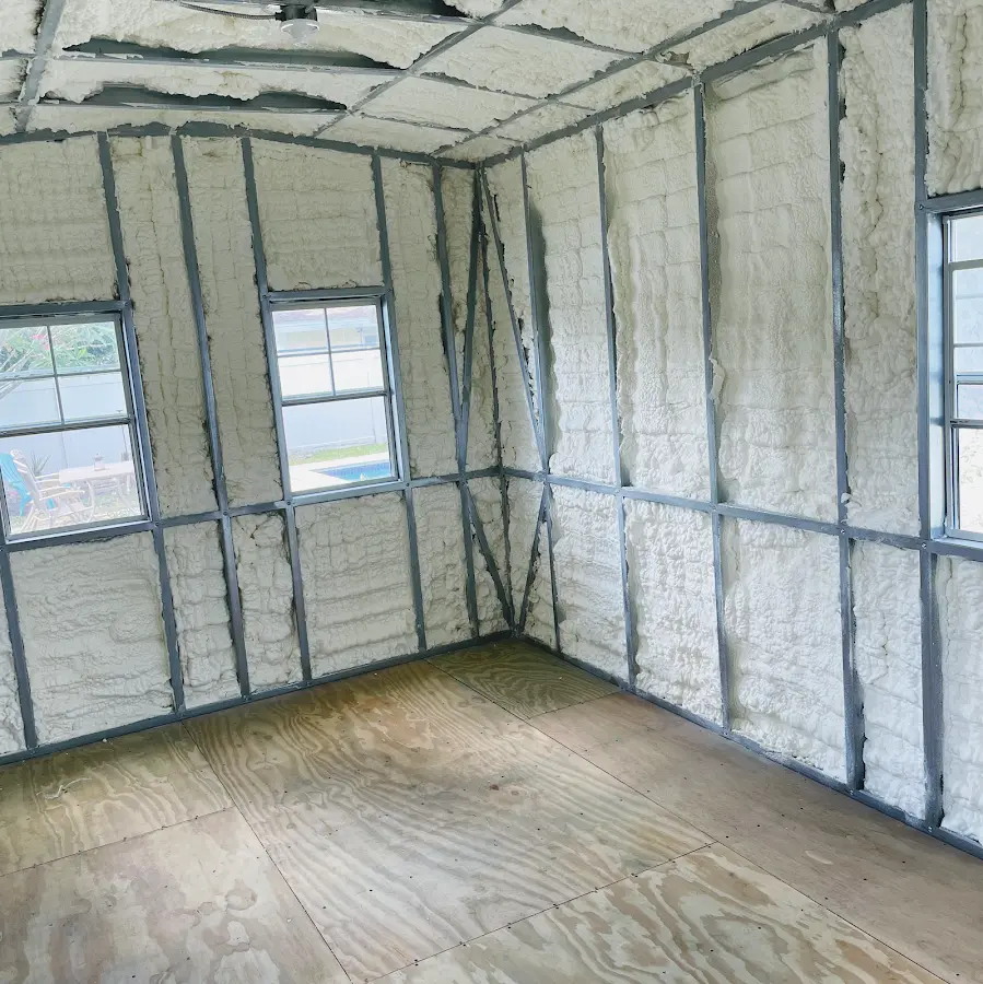 Closed-cell spray foam insulation applied to wall cavities in a residential project in Severn