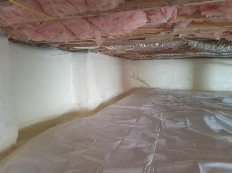 Crawl space encapsulation with closed-cell spray foam for Commercial Roof Restoration in Severn